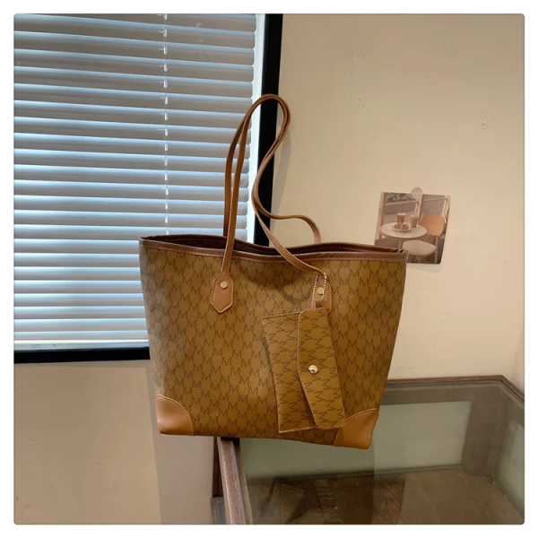 The Adorn Curve Bag - Premium Monogram Canvas Tote