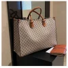 The Adorn Curve Bag - Premium Monogram Canvas Tote