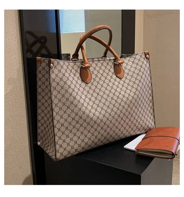The Adorn Curve Bag - Premium Monogram Canvas Tote