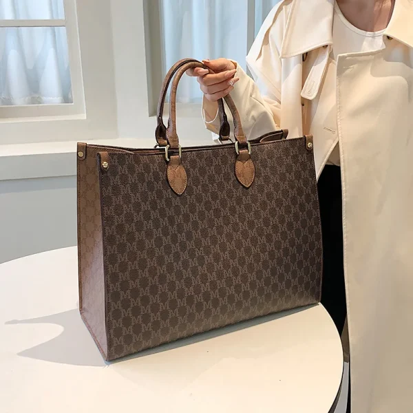 The Adorn Curve Bag - Premium Monogram Canvas Tote