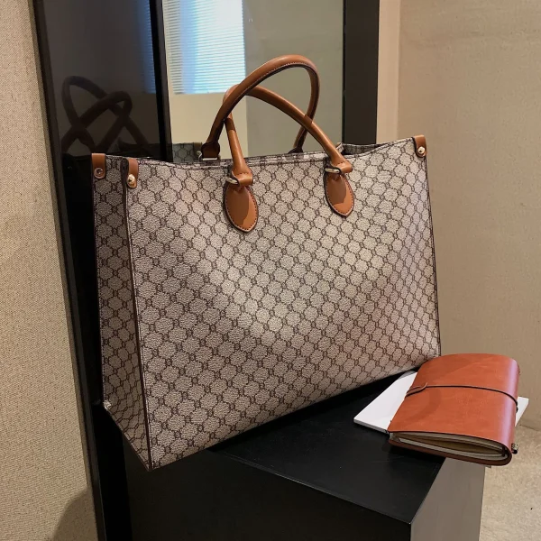 The Adorn Curve Bag - Premium Monogram Canvas Tote