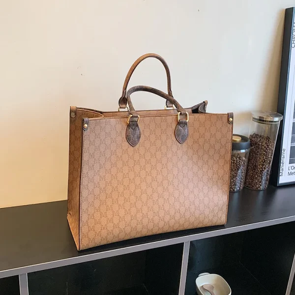The Adorn Curve Bag - Premium Monogram Canvas Tote