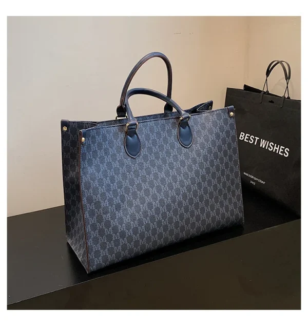 The Adorn Curve Bag - Premium Monogram Canvas Tote
